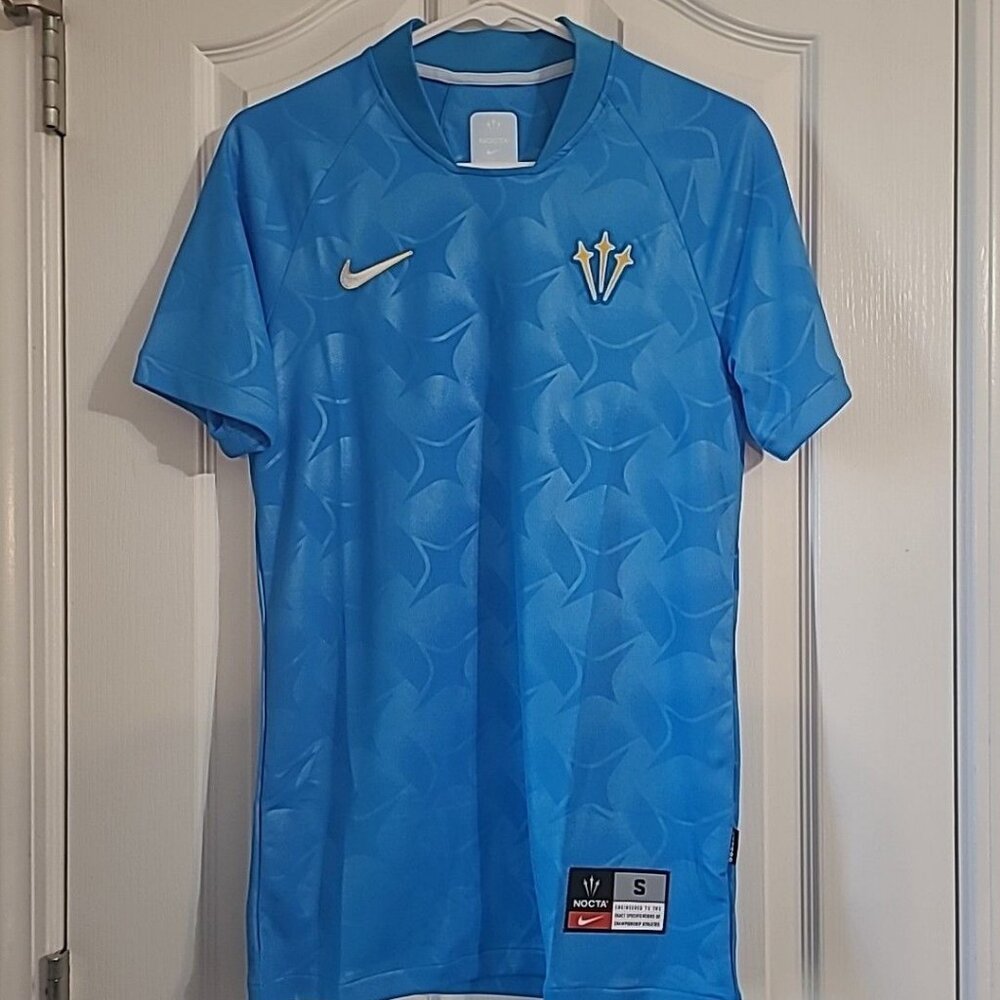 Nike NOCTA Men's Size Small Turks and Caicos Blue Glow Soccer Jersey DR2616-450